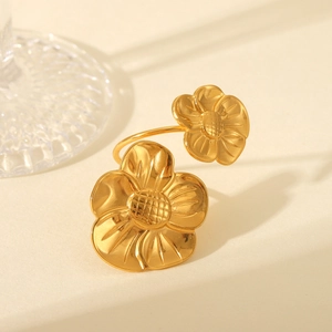 Close-up of elegant double flower vintage titanium steel ring in gold finish