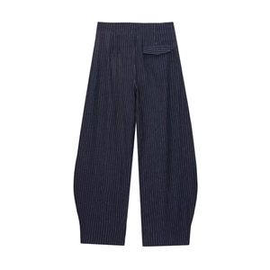 Detailed view of navy blue striped balloon pants with unique curved cut and back pocket