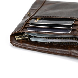 Macro view of oil wax leather wallet interior featuring card slots and zipper pocket