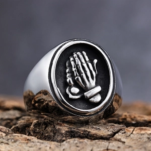 Polished stainless steel prayer skeleton hand ring with gothic embossed stamp design