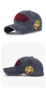 Detailed macro view of vintage washed baseball cap featuring red 3D embroidery and side patch