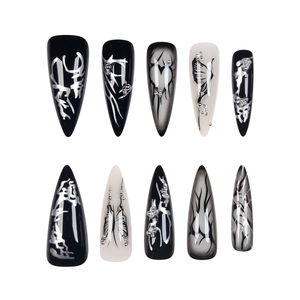 Black and grey punk style stiletto press-on nails with heart and butterfly 3D motifs