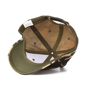 Internal view of camouflage baseball cap showing polyester fabric and quality stitching