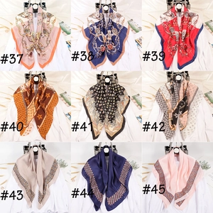 Grid view of various satin square scarves with elegant geometric patterns and prints