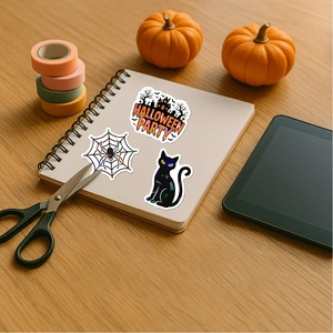 Halloween stickers with black cat and haunted house on a white notebook for DIY decoration