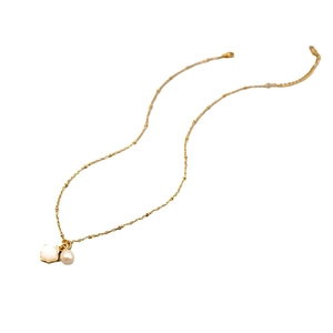 Elegant gold freshwater pearl necklace with shell pendant on a clean white background