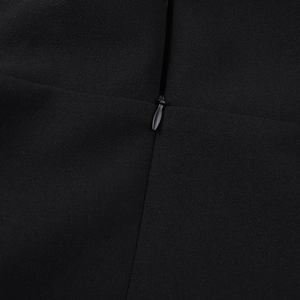 Detail of high-quality invisible zipper closure on the black slim fit mini dress