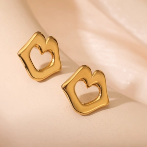 Minimalist gold metal square stud earrings with heart cutout on soft beige background