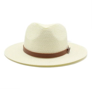 Close-up of cream woven Panama hat with brown leather band and metallic buckle detail