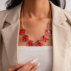 Three-piece vintage gold necklace set with red enamel textured circular pendants