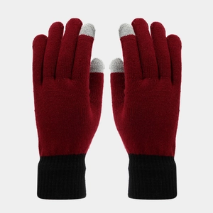 Detail of wine red knit touchscreen gloves with black ribbed cuffs and grey conductive tips