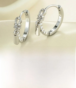 Detail of silver copper zipper drop earrings with zircon inlay and 12mm inner diameter