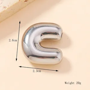 Macro shot of 3D bubble letter C pendant with dimensions 2.6cm by 2.3cm and 20g weight