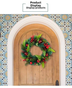 Detailed view of Christmas wreath featuring red berries, pine cones and shiny ornaments