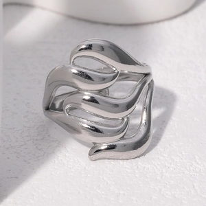 Classic silver stainless steel ring with an abstract wavy flame design on white background