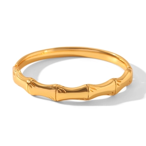 Detailed view of 18k gold plated stainless steel bracelet with bamboo node design