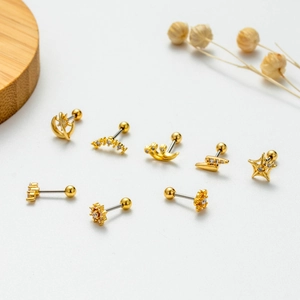 Golden stainless steel stud earrings set featuring star moon and flower designs