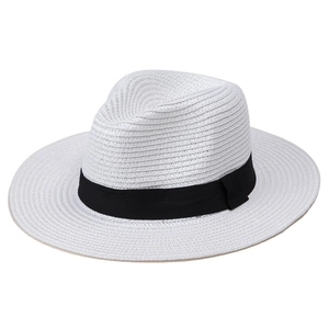 Close-up of classic white straw panama hat featuring textured weave and black ribbon band