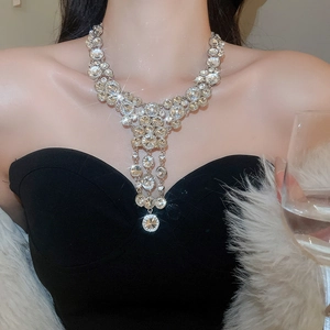 Close-up of sparkling crystal tassel pendant necklace with silver layered fringe chains