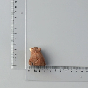 Hand-carved wooden bear figurine in sitting pose, measured at 3.5cm height with scale