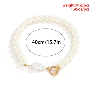 Baroque pearl necklace with gold OT toggle clasp and 40cm length on white background