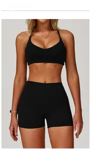 Front view of premium black brushed yoga set featuring V-neck bra and high waist shorts