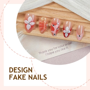 Handmade almond press-on nails with 3D floral relief, pearls, and sparkling rhinestones