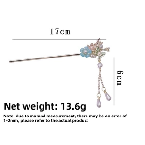 Detail view of floral hair pin with dimensions 17cm length and 6cm tassel weight 13.6g