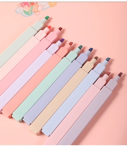 Close-up of assorted macaron colored chisel tip highlighters on a pink background