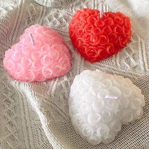 Three rose relief heart-shaped scented candles in pink, red, and white colors