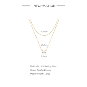 Macro detail of gold S925 sterling silver double layer chain with AAAAA zircon pendant