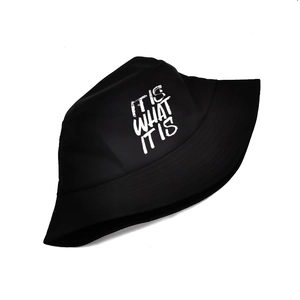 Black cotton bucket hat with white 'IT IS WHAT IT IS' lettering and sun protection