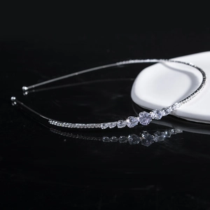 Elegant silver metal headband featuring sparkling clear round and teardrop crystals