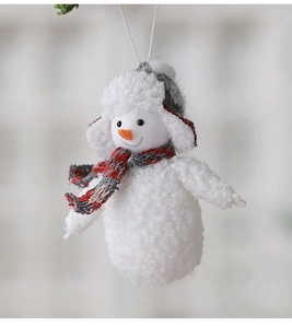 Detail of plush Christmas snowman ornament with striped scarf and fluffy textured hat