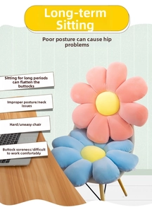 Close-up of pink and blue daisy flower cushions on chair with soft plush texture