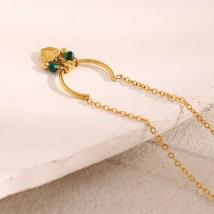 Detail of 18K gold-plated necklace featuring green malachite beads and heart pendant