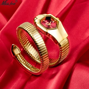 Luxurious gold snake-shaped women's watch with red dial on elegant silk background