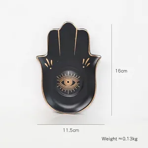 Detail der Hamsa-Hand-Schmuckschale mit Maßen 16cm x 11,5cm in Schwarz und Gold