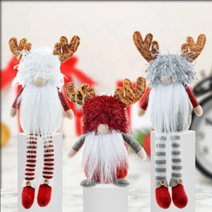Three Christmas reindeer gnomes with long legs in red, grey and white plush fabrics