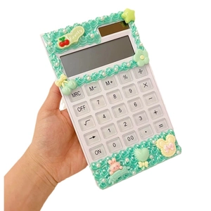 DIY cream glue calculator with cute resin charms and pearls on white background
