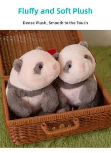 Close-up of two fluffy panda plush toys sitting in a woven basket with dense soft fur