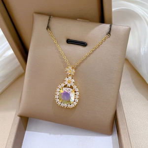 Elegant gold titanium steel necklace with floral diamond pendant and colorful gemstone