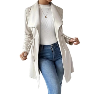 Detail of elegant beige trench coat featuring a drawstring waist and large lapels