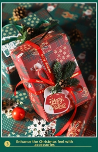 Detail of Christmas gift wrapping set with red plaid paper, Merry Christmas ribbon and tags