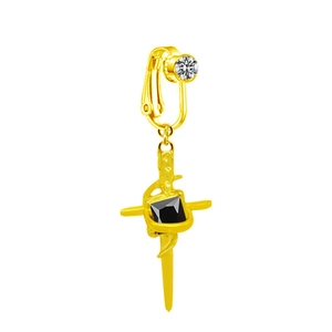 Macro view of golden sword-shaped clip-on navel ring with black square gemstone detail