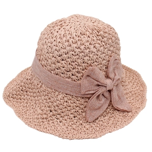 Elegant light pink foldable straw hat for women with a stylish bow for beach and summer sun