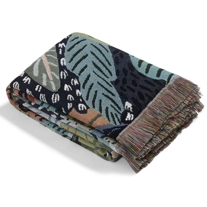 Bohemian tropical rainforest throw blanket with leopard pattern and woven tassels