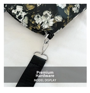 Macro shot of silver metal hardware and nylon strap on a skull print tote bag