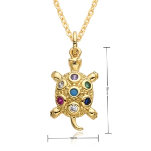 Detailed size view of a golden turtle pendant with colorful zircons, 18mm by 10mm dimensions
