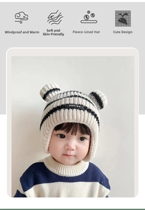 Detail of baby striped knit earflap hat with plush lining and cute ear design